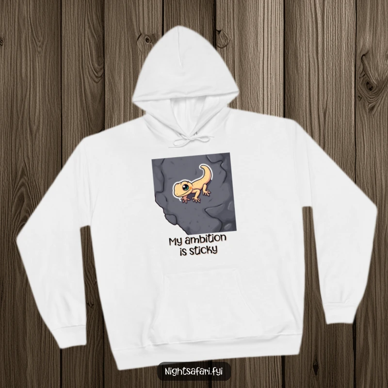 Funny Gecko Hoodie: A determined gecko humorously scales a textured surface, offering warmth and laughter.