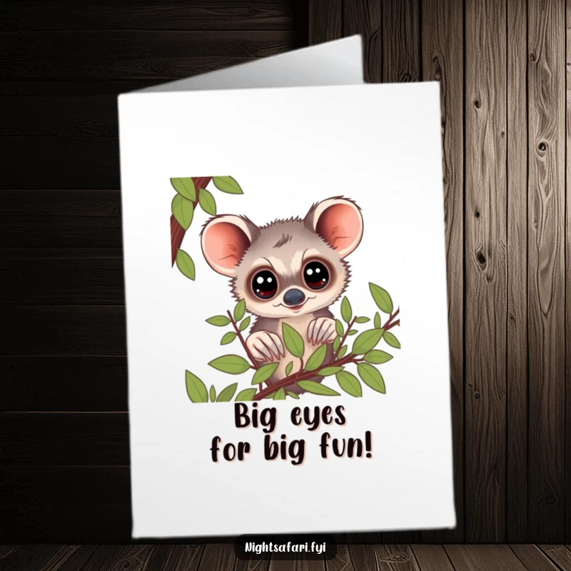 Funny Free Printable Birthday Card: A curious bushbaby with huge eyes peeking out from lush green foliage.