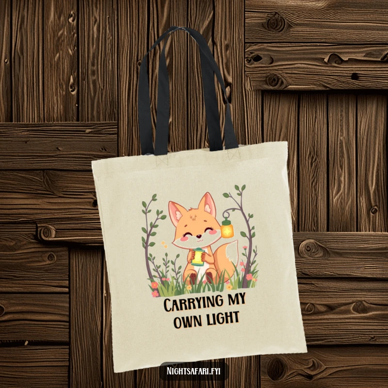Funny tote bag featuring a smiling fox peeking from bushes, holding a glowing lantern, perfect for carrying essentials humorously.