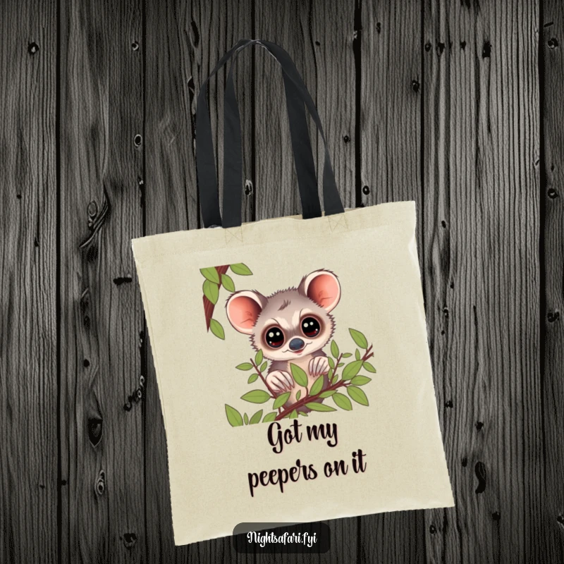 Funny Bushbaby Tote Bag: A curious bushbaby with big eyes peering from foliage, a humorous and functional accessory.